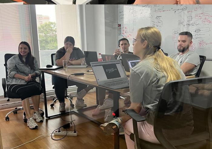 Upshift team brainstorming at the whiteboard